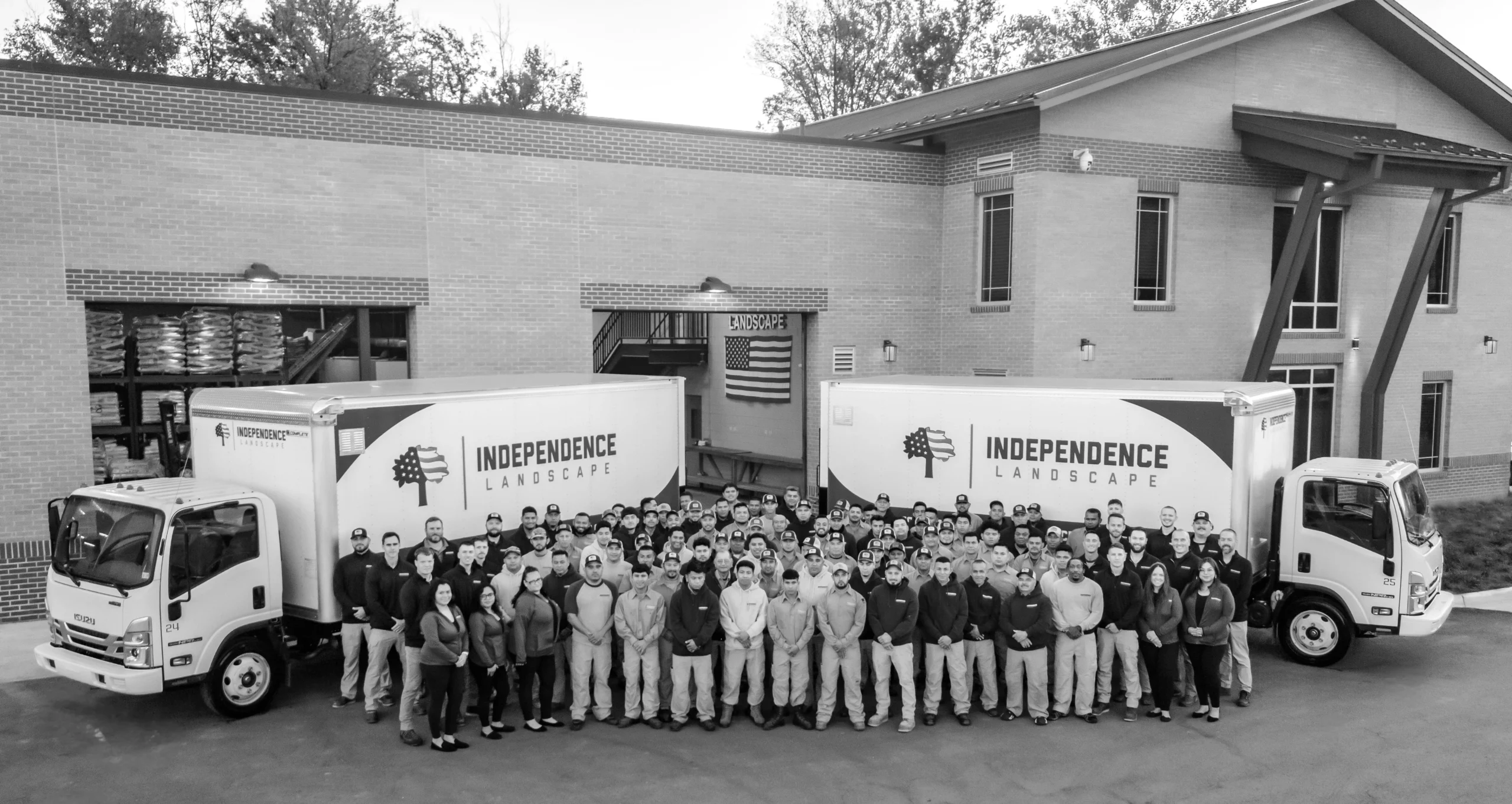 A black & white photo of the Independence Landscaping Team